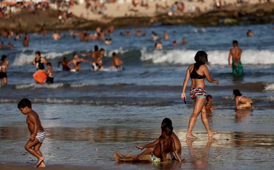 salvador, bahia / brazil - September 9, 2015: Children are seen playing on Itapua Beach in Salvador city.

