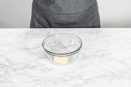 Melting stick of unsalted butter in a microwave.