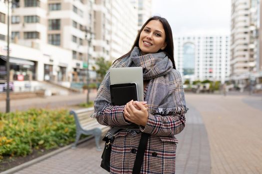 portrait of a successful middle-aged woman businessman against the backdrop of urban development.