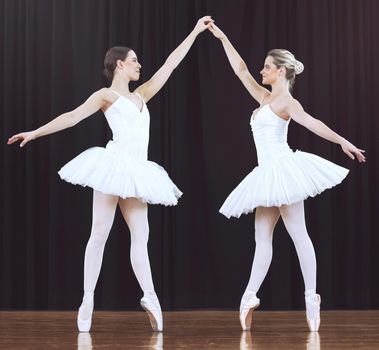 Ballet women, stage and dance performance for creative show, recital or competition in classical ballet theater. Beauty, dancer partnership and prima ballerina team work together on abstract dancing.