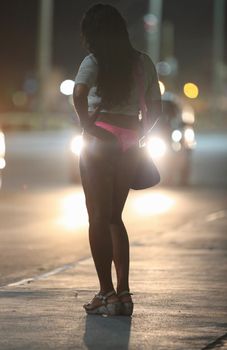 salvador, bahia, brazil - october 2, 2015: Trans woman working as a prostitute on a street in Salvador city.