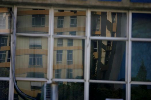 salvador, bahia / brazil - september 23, 2015: reflections of the street are seen in a mirrored building in the city of Salvador.