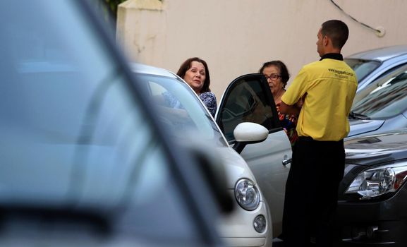 salvador, bahia / brazil - september 14, 2015: Parking valet is seen working in the Graca neighborhood in Salvador.