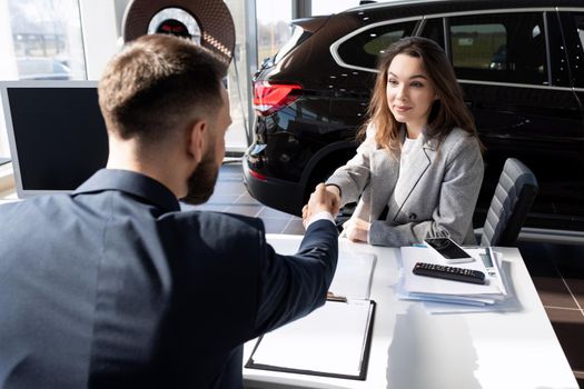 completion of a deal in a car dealership for the sale of a new car of a young girl.