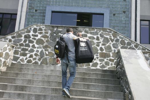 salvador, bahia / brazil - July 14, 2015: Federal Police agents are seen arriving at the Federal Police Superintendence in Salvador, after serving warrant during operation.
