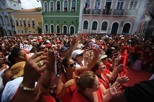 salvador, bahia, brazil - december 4, 2015: hands raised during mass in honor of Santa Barbara in Pelourinho, historic center of the city of Salvador.
