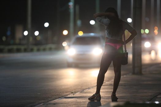 salvador, bahia, brazil - october 2, 2015: Trans woman working as a prostitute on a street in Salvador city.