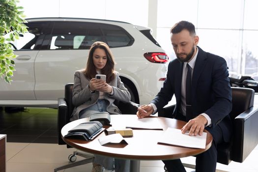 process of buying a new car in a car dealership.