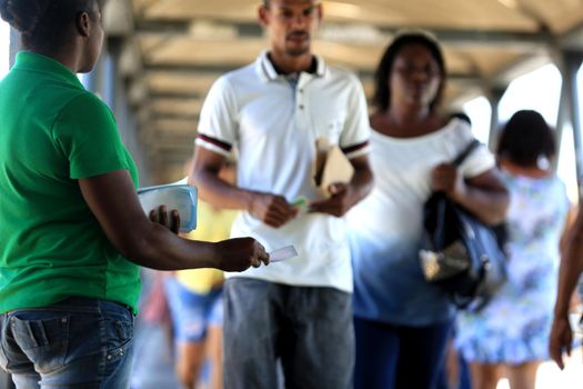 salvador, bahia / brazil - november 12, 2015: person is seen distributing advertising pamphlet in the city of Salvador.



