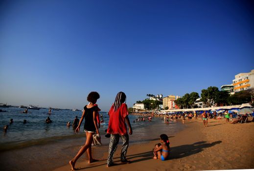 salvador, bahia / brazil - december 5, 2015: people are seen on Porto da Barra beach in the city of Salvador.
