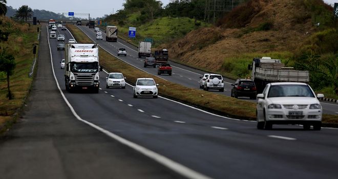 simoes filho, bahia / brazil - november 20, 2015: Movement of cargo vehicles and automobiles on the federal highway BR 324 in the municipality of Simoes Filho.
