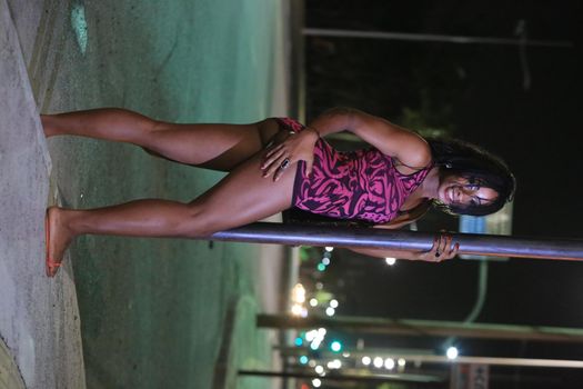 salvador, bahia, brazil - october 5, 2015: Trans woman working as a prostitute on a street in Salvador city.