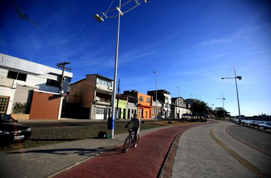 salvador, bahia / brazil - december 2, 2015: cyclist on a bike path on Avenida Beira Mar in the Ribeira neighborhood in the city of Salvador.