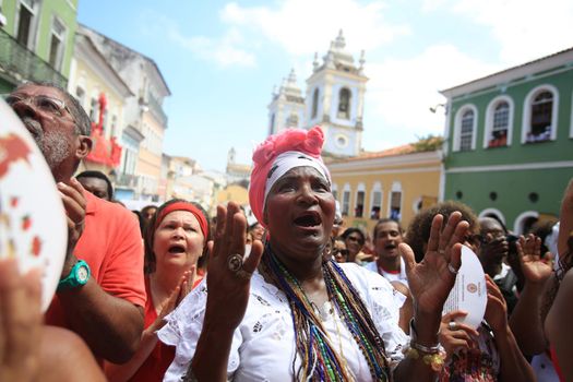 salvador, bahia, brazil - december 4, 2015: Santa Barbara devotees during Mass in Praised Santa at Largo do Pelourinho in Salvador city.