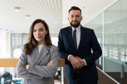 portrait of a man and a woman in formal clothes representative employees of the company.