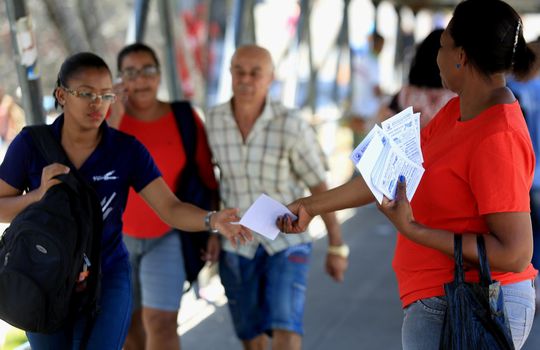 salvador, bahia / brazil - november 12, 2015: person is seen distributing advertising pamphlet in the city of Salvador.



