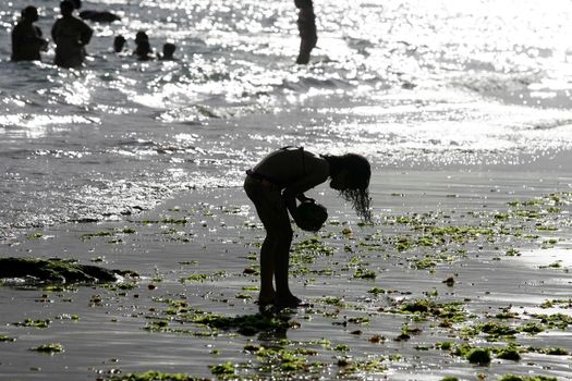 salvador, bahia / brazil - december 5, 2015: child is seen on Porto da Barra beach in the city of Salvador.
