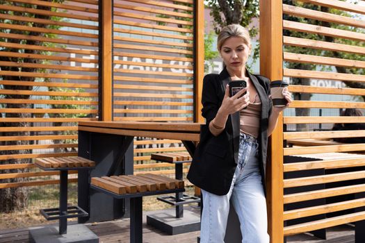 young business woman talking on the phone in the interior of a street cafe.