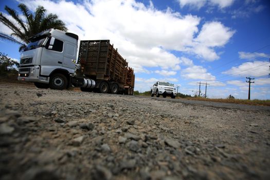 camacari, bahia, brazil - july 12, 2015: hole in the asphalt on the access road to the Industrial Pole in the city of Camacari. 