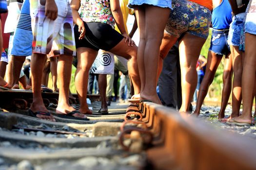salvador, bahia / brazil - november 23, 2015: civil police investigators are investigating a murdered person near the suburban train line in the city of Salvador.