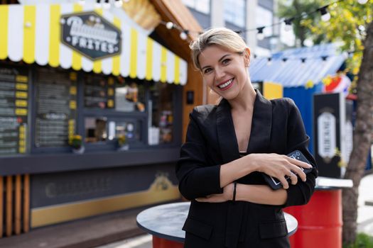 business woman hostess of a cafe against the background of not her business.