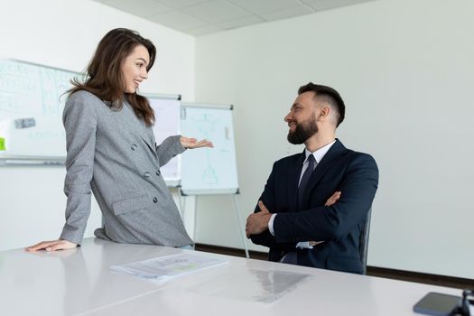 colleagues during negotiations in the office discuss with each other.