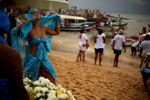 salvador, bahia / brazil - february 2, 2020: devotees and admirers of the orixa yemanja, a candomble entity, seen on the rio Vermelho beach, in the city of salvador, during a religious celebration.
