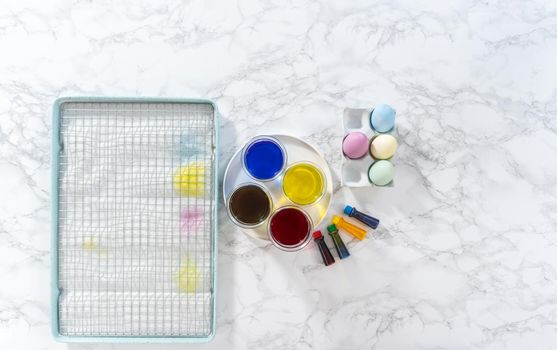 Coloring hard-boiled white eggs with natural food coloring.