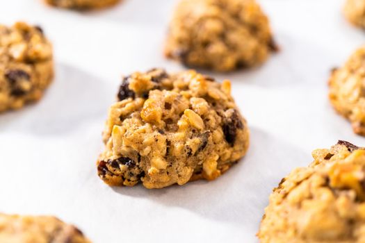 Freshly baked soft oatmeal raisin walnut cookies.