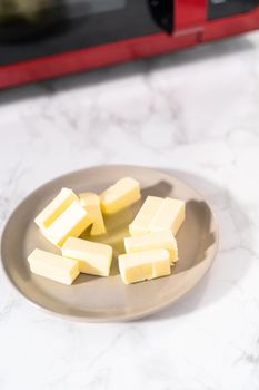 Softened sticks of unsalted butter on in the microwave.