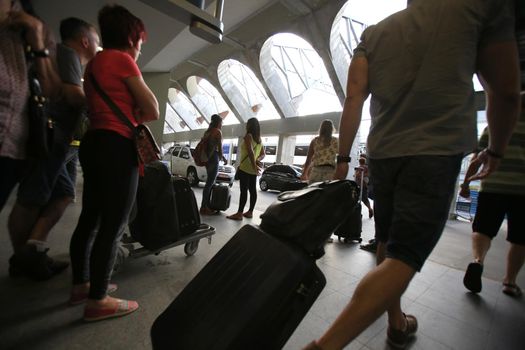 salvador, bahia, brazil - february 3, 2016: passengers carrying travel bag at airport in Salvador city.