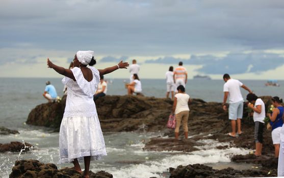 salvador, bahia / brazil - february 2, 2016: Candomble supporters and supporters greet the Yemanja orixa during a festan on the Rio Vermelho neighborhood beach in Salvador. 