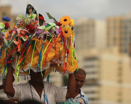 salvador, bahia / brazil - february 2, 2016: Candomble supporters and supporters greet the Yemanja orixa during a festan on the Rio Vermelho neighborhood beach in Salvador. 