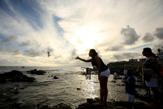 salvador, bahia, brazil - february 2, 2017: Candomble members and admirers of the Orixa Yemanja during a religious ritual in the city of Salvador.