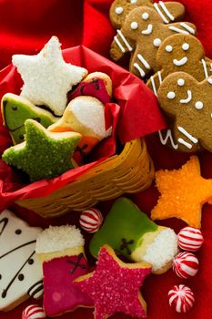 Assorted christmas cookies on red background.