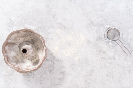 Flat lay. Greasing bundt cake pan to bake July 4th bundt cake with chocolate stars.