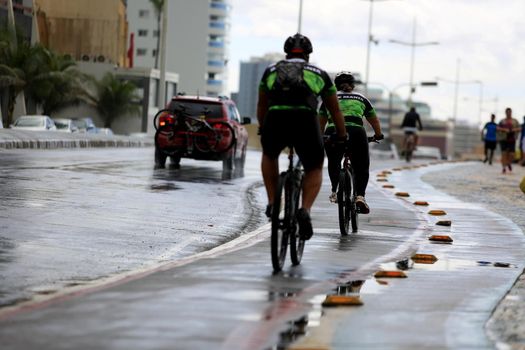 salvador, bahia, brazil - august 7, 2016: person riding a bicycle on a bike path in the city of Salvador.