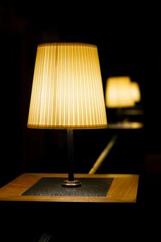Image of the Row table lamps at a low light atmospheric restaurant. Selected focus and bokeh