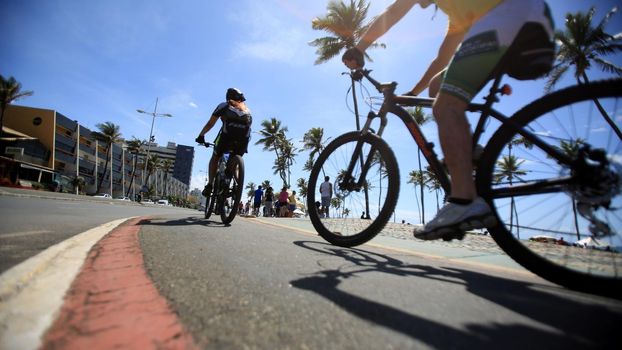salvador, bahia / brazil - september 18, 2016: Cyclist is seen on bike lane in the Jardim de Alah, Waterfront Salvador. The bicycle is mainly used for commuting to work.