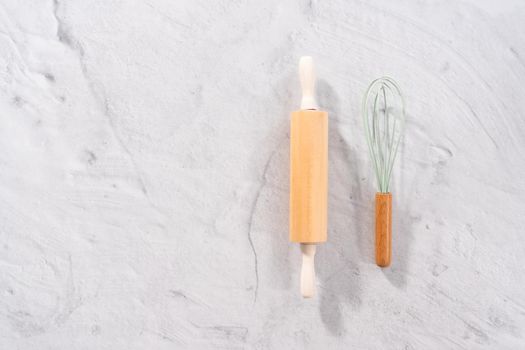 Flat lay. Silicone cooking utensils with wooden handle.
