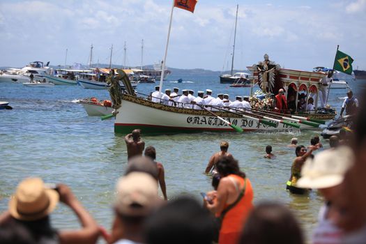 salvador, bahia, brazil - january 1, 2017: image of Bom Jesus dos Navegantes being carried by devotees on Boa Viagem beach after crossing the sea at Baia de Todos os Santos in Salvador.