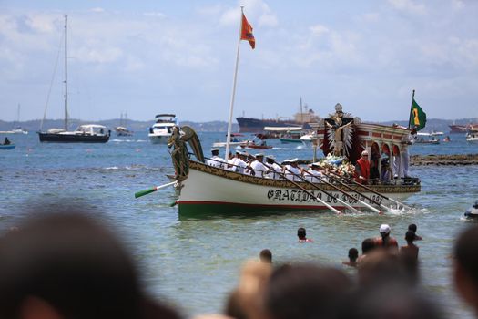 salvador, bahia, brazil - january 1, 2017: image of Bom Jesus dos Navegantes being carried by devotees on Boa Viagem beach after crossing the sea at Baia de Todos os Santos in Salvador.