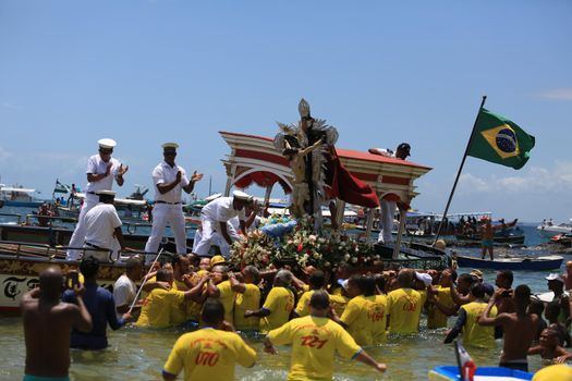 salvador, bahia / brazil - january 1, 2016: image of Bom Jesus dos Navegantes leaves the Galeota Gratidao do Povo after sailing in a maritime procession through the Baía de Todos os Santos, in the city of Salvador.

