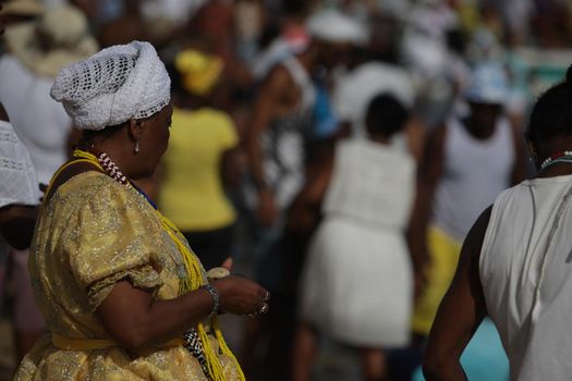 salvador, bahia / brazil - february 2, 2017: Candomble supporters and supporters greet the Yemanja orixa during a festan on the Rio Vermelho neighborhood beach in Salvador.