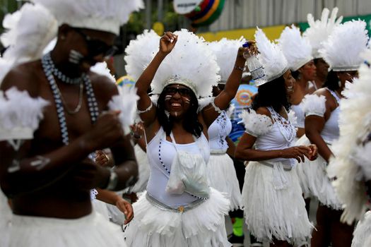 salvador, bahia, brazil - february 24, 2017: Members of the Commanches carnival block are seen during a parade on the Salvador city's carnival circuit.