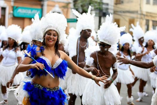 salvador, bahia, brazil - february 24, 2017: Members of the Commanches carnival block are seen during a parade on the Salvador city's carnival circuit.
