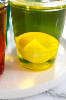 Coloring hard-boiled white eggs with natural food coloring.