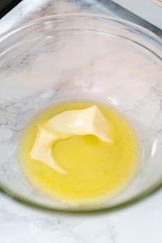 Melting stick of unsalted butter in a microwave.