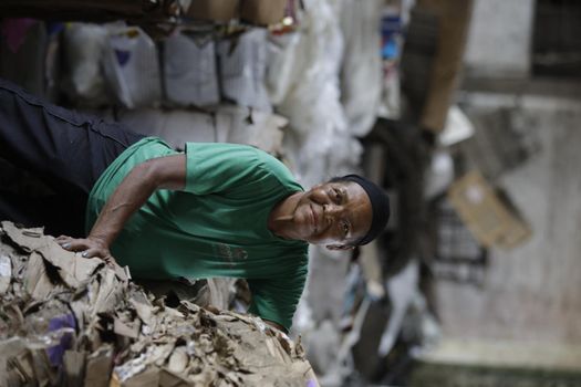 feira de santana, bahia, brazil - may 15, 2019: person sorting material to be recycled in a cooperative in the city of Feita de Santana.