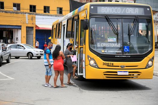 salvador, bahia, brazil - february 8, 2021: people are seen getting on public transport buses at the Barroquinha terminal, in the city of Salvador.